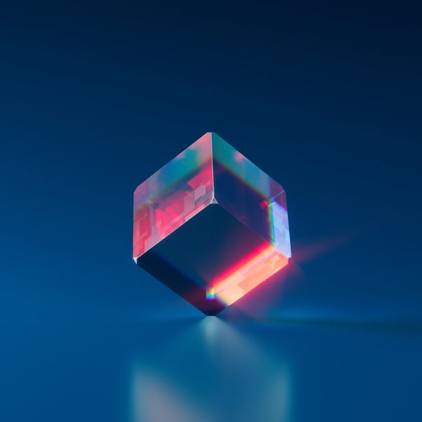 a multicolored cube resting on its edge